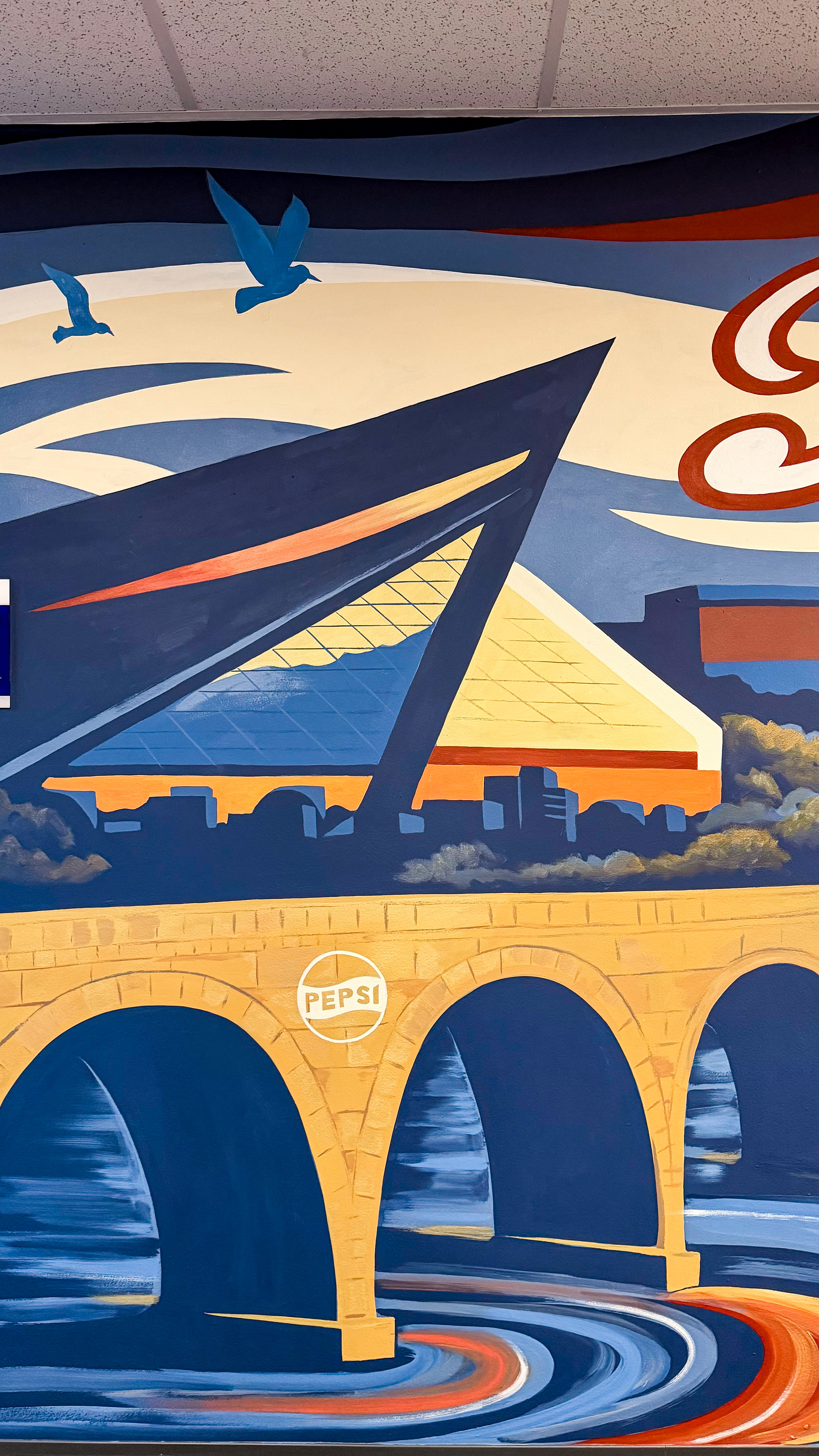 Wider view of the finished PepsiCo facility mural.