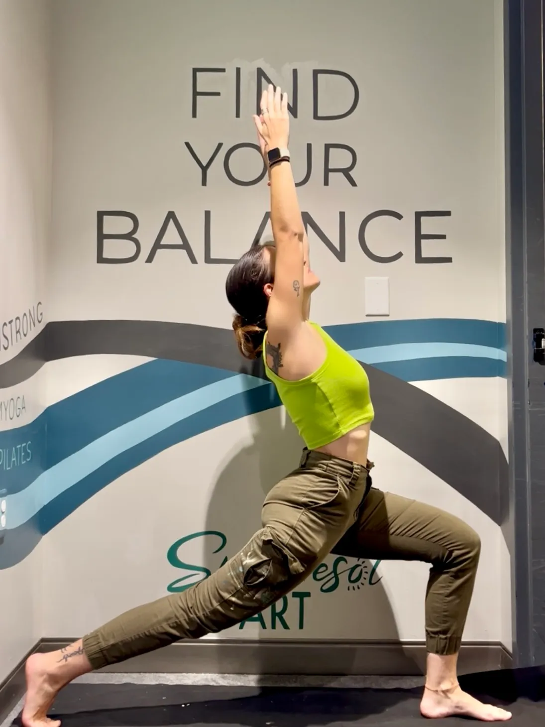 Eaum Yoga studio in use with the mural backdrop.