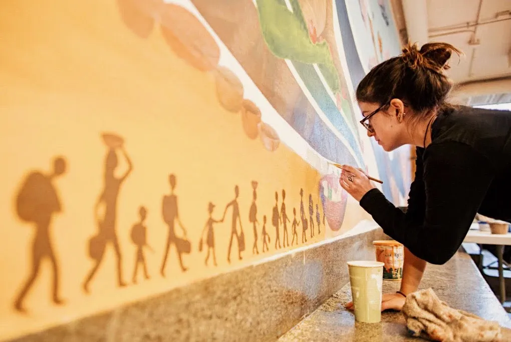 Pachamama mural section with goddess and nature symbolism.