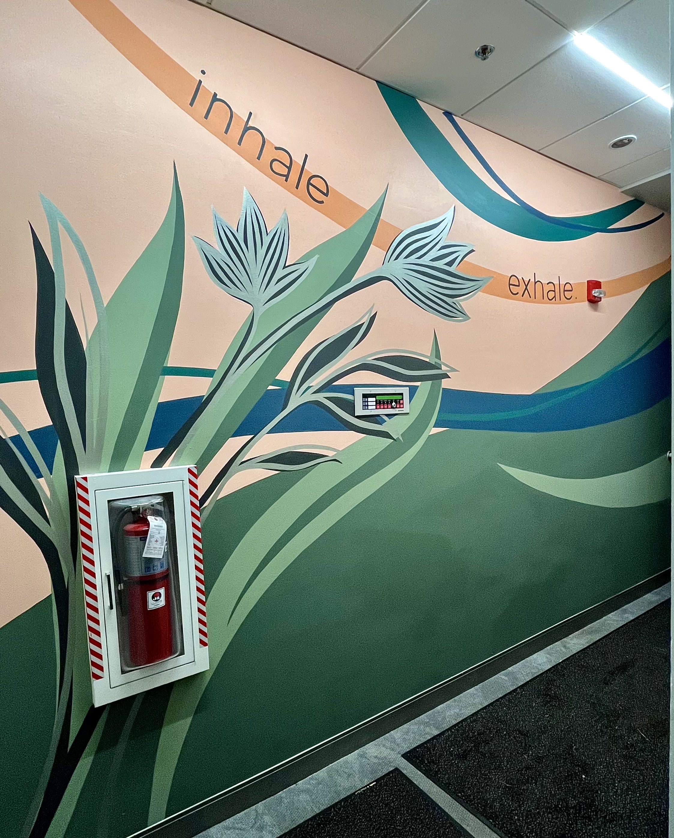 Eaum Yoga mural detail with metallic accents.