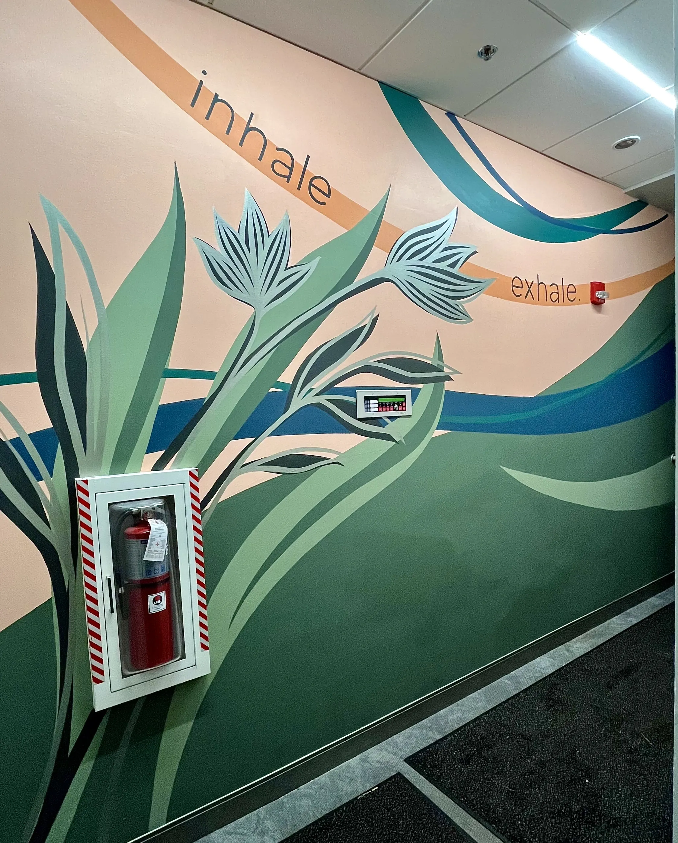 Eaum Yoga mural detail with metallic accents.
