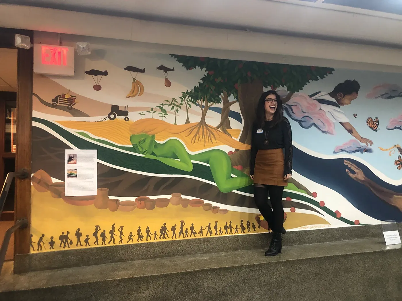 Finished mural with artist